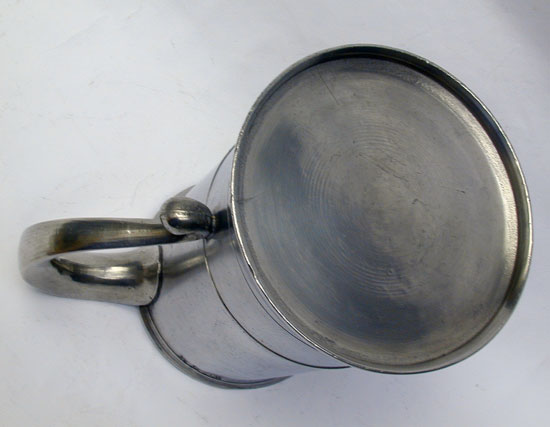 A Quart Pewter Export Mug Used as a Measure