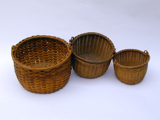 An Assembled Stacking Set of 3 Bale Handled Baskets 