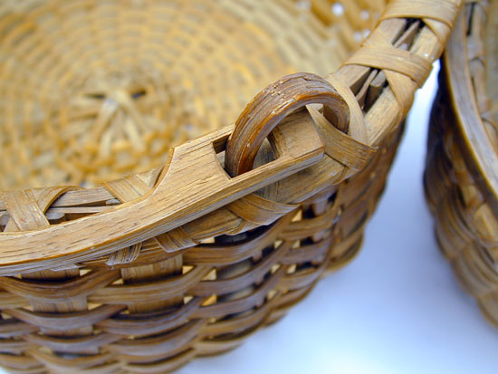 An Assembled Stacking Set of 3 Bale Handled Baskets 
