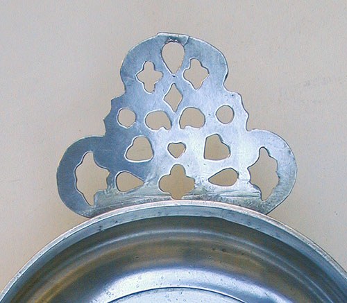 An Unmarked Export Pewter Porringer with Geometric Handle