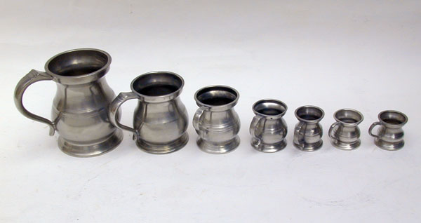 An Assembled Set of Enlish Pewter Bellied Pub Measures