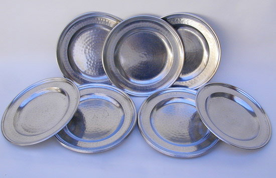 A Set of 12 Planished Export Plates by Thomas Powell