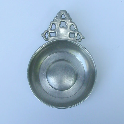An Unmarked English or American Geometric Handle Porringer