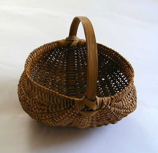 A Late 19th early 20th Century Buttocks Basket