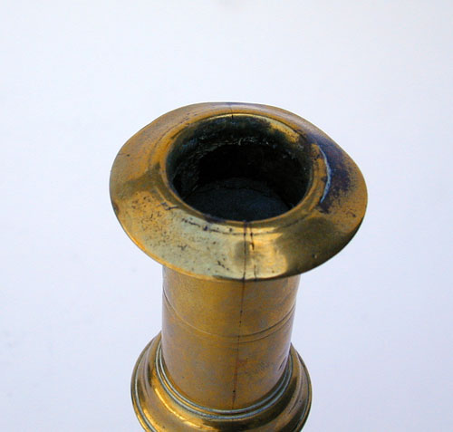 A Mid 18th Century English Push Up Brass Candlestick