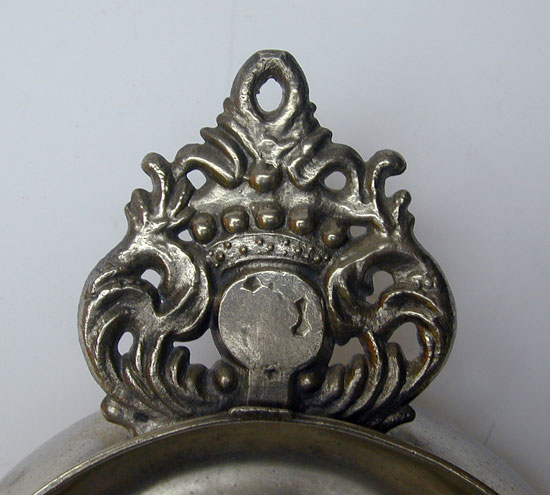 A Wide Bellied Crown Handle Porringer