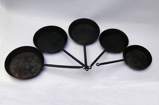 An Assembled Set of Five Whitfield Fry Pans