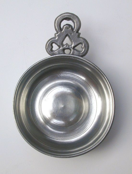 A Pewter Porringer with Heart and Crescent Moon Handle